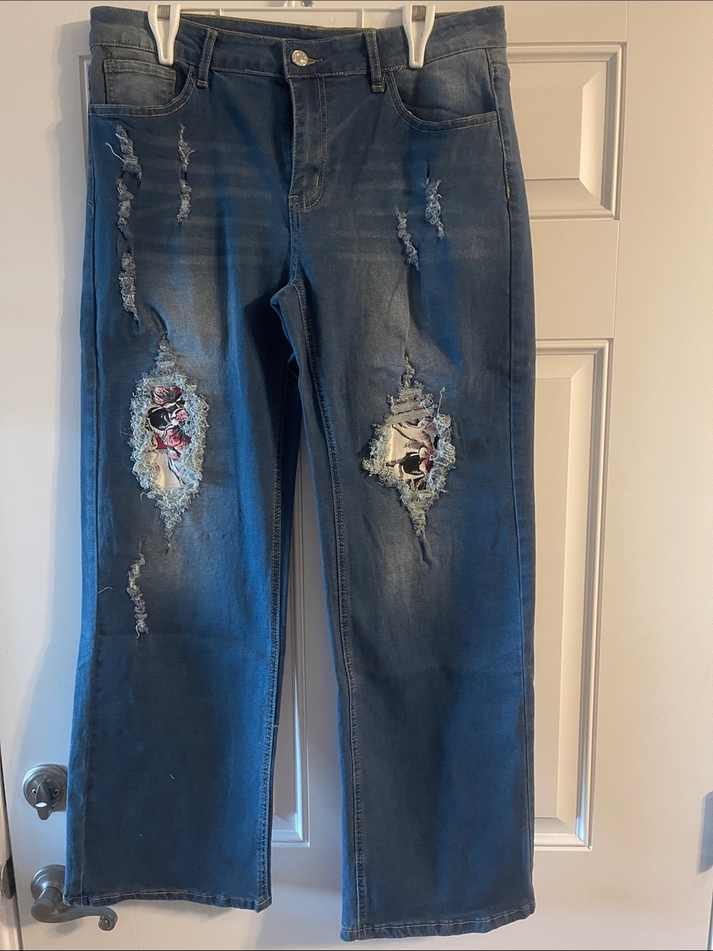 Distressed Dark Blue Jeans with skull flower Patch Detail